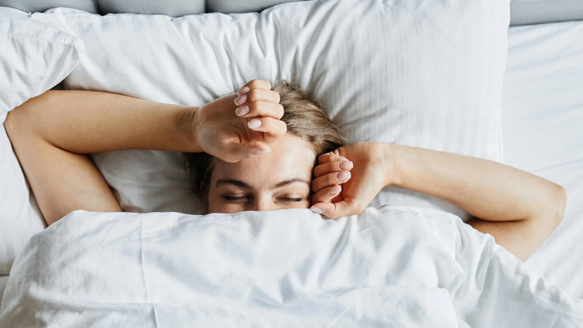 Woman waking rested in bed