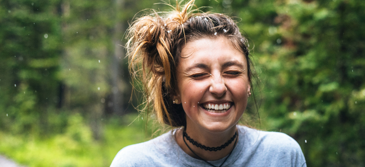 woman smiling representing humanity marketing