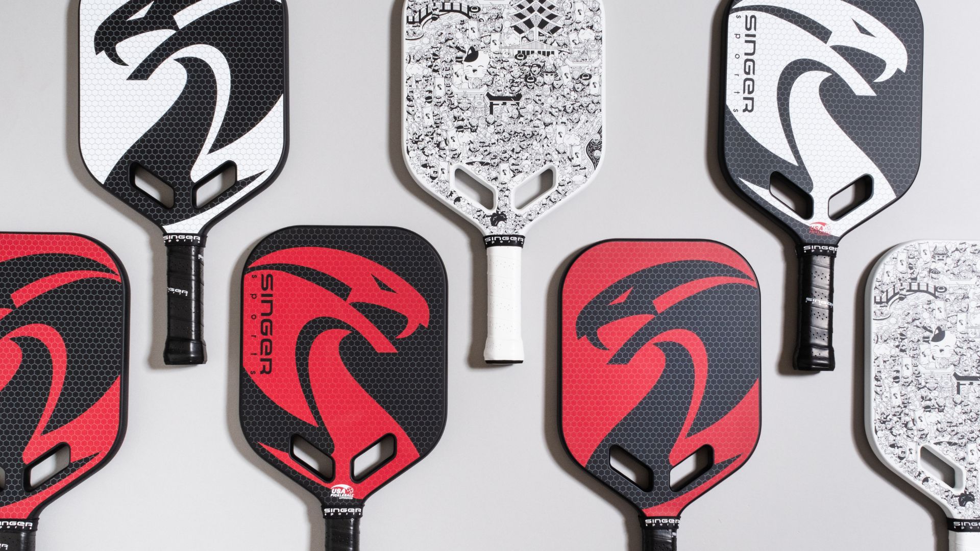 singer sports multiple pickleball paddles